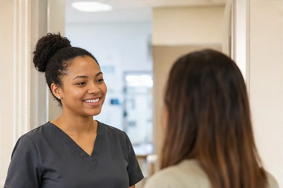 A certified MA in an exam room